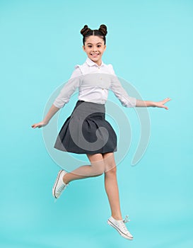 Funny excited jumping teenager. Happy schoolgirl, positive and smiling emotions of teen girl. Full length jump of
