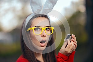 Funny Excited Woman with Rabbit Ears Holding Easter Chick