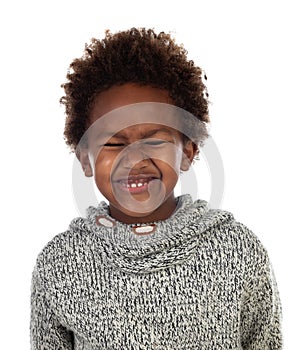 Funny expression of a small african child with clossed eyes