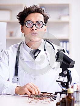 Funny eye doctor in humourous medical concept