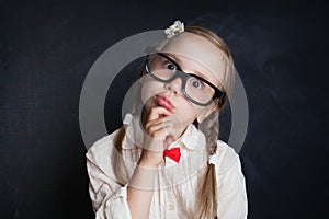 Funny Face of Schoolgirl. Child Thinking. Back to School