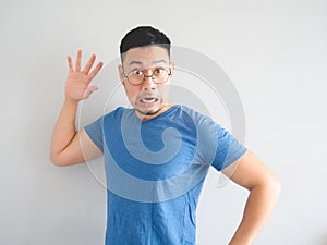 Funny face of shocked Asian man.