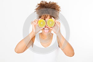 Funny face with tongue out. Beautiful young african american woman with orange fruit isolated on white background. Afro girl, diet
