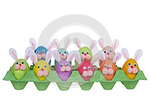 Funny faces bunny easter eggs in an egg carton