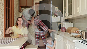 Funny family in chaos in the kitchen during quarantine