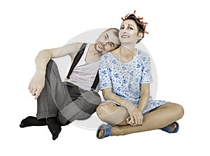 Funny family couple man and woman sitting isolated