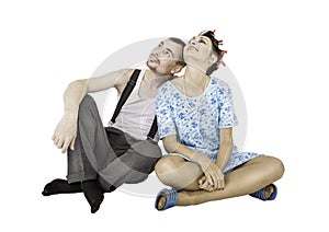 Funny family couple man and woman sitting isolated