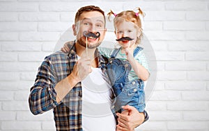 Funny family father and child with a mustache