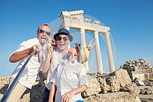 Funny family take a selfie photo on Apollo Temple colonnade view