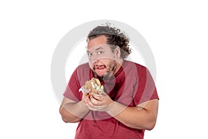 Funny fat man eating hamburger. Fast food, unhealty eat. Overweight and health problems