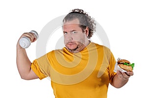 Funny fat man eating unhealthy food and trying to take exercise isolated on white background