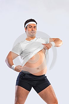 A funny fat man isolated on white background. Obesity and eating disorder. Concept for dietetics and fitness advertising