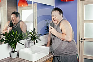 Funny fat man in the shower. Bath