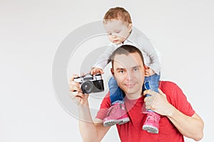 Funny father and child making selfie at vintage camera