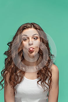 The funny Fdumbyoung woman`s portrait with happy emotions