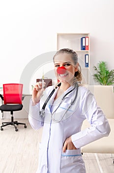 The funny female doctor working in the clinic