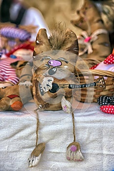 Funny figures of cats sewed from fabric, on sale at the Slavic f