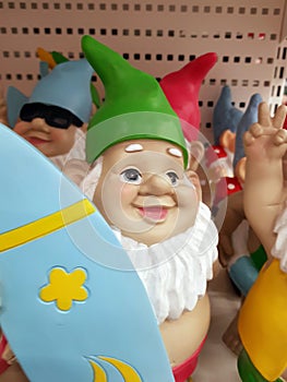 Funny figures of garden gnomes on sale in the store