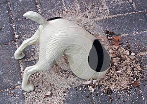 Funny figurine of digging dog