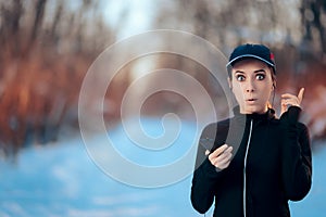 Funny Fitness Woman Listening to Music on Her Smartphone
