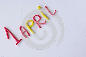 Funny font April Fools` Day, written in plasticine. Fools day phrase from plasticine, letters on white background