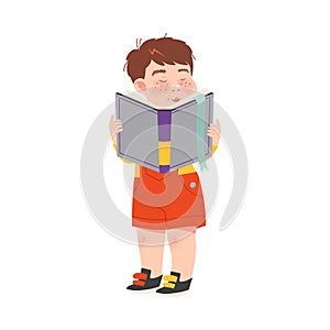 Funny Freckled Boy Standing with Open Book and Reading Vector Illustration