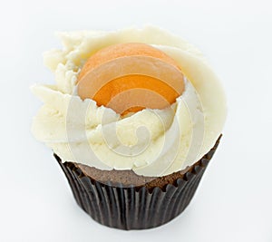 Funny fried egg cupcake on white background
