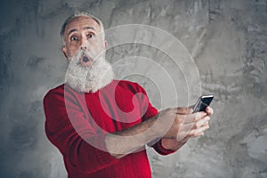 Funny funky crazy white hair beard old man use his smartphone blogging get x-mas newyear season tradition discounts