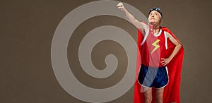 Funny funny cheerful man in a superhero costume in sports clothe