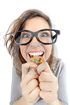 Funny geek girl eating a cookie photo
