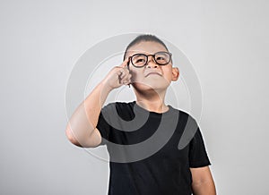 Genius boy Thinking in studio shot