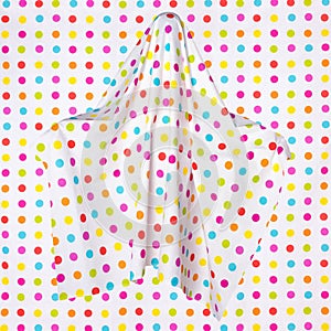 Funny ghost with colorful polka dots on an edentulous background. Mystical sign, avatar.