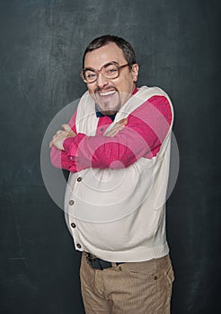 Funny giggle teacher man in retro style on blackboard photo
