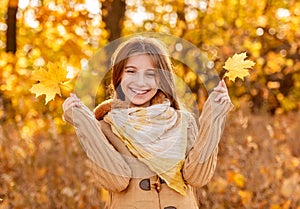 Funny girl with autumn leaf