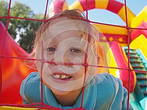 Funny girl in bounce castle