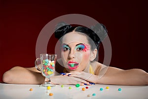 Funny girl with candy drops