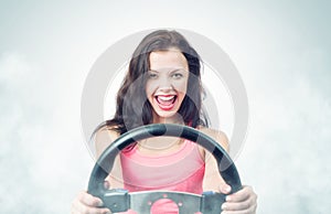 Funny girl with car wheel and smoke