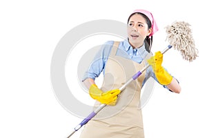 Funny girl with cleaning playing air guitar