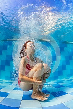 Funny girl dive in swimming pool