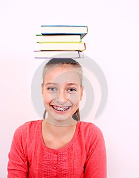 Funny girl with four books on head