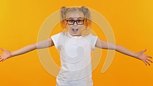 Funny girl in glasses throwing dollars into air, smart kid receiving stipend