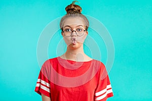 Funny girl with hairbun making a funny face