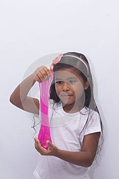Funny girl holdin a glitter slime, photo with white background.