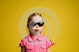 Funny girl pouting her lips. Stock photo portrait of adorable little kid