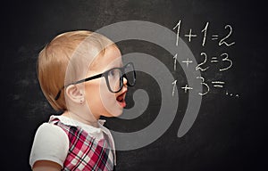 Funny girl pupil solves arithmetic examples