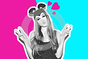 Funny girl represents a small cat or mouse. Woman with a bright makeup hairstyle and night dress mouse ears having fun