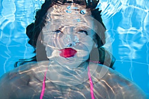 Funny girl swim swimming under sea water. summer vacation. underwater