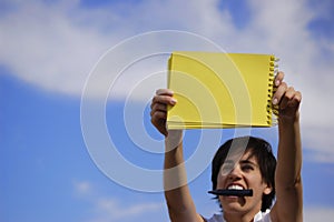 Funny girl with a yellow notebook