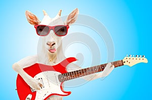 Funny goat in sunglasses with electric guitar