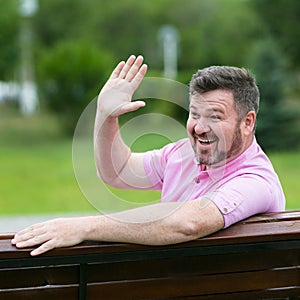 Funny good-natured cheerful middle-aged man with a beard